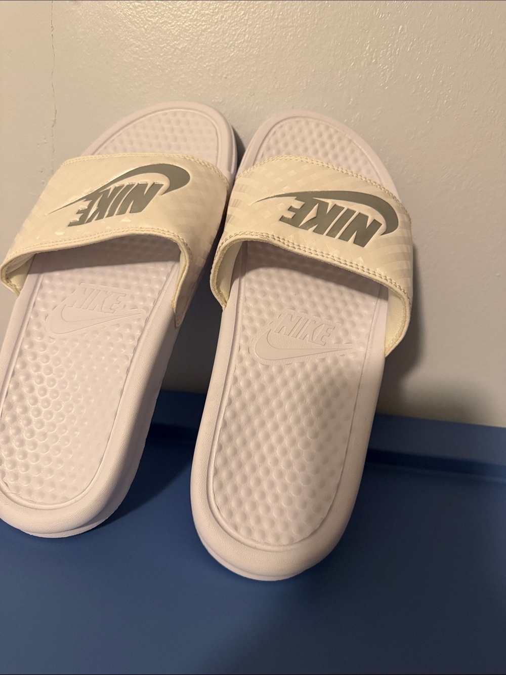 Nike White Slide Sandals with Embossed Swoosh